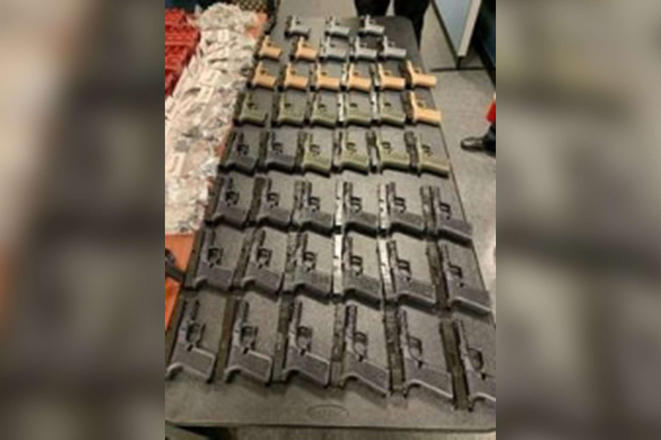 PHOTO: Evidence photos released by the Department of Justice show some of the 45 ghost guns  seized from the home of Robert Alcantara, as well as photographs of firearms Alcantara allegedly intended to sell to buyers, Providence, R.I., Jan. 6, 2022.