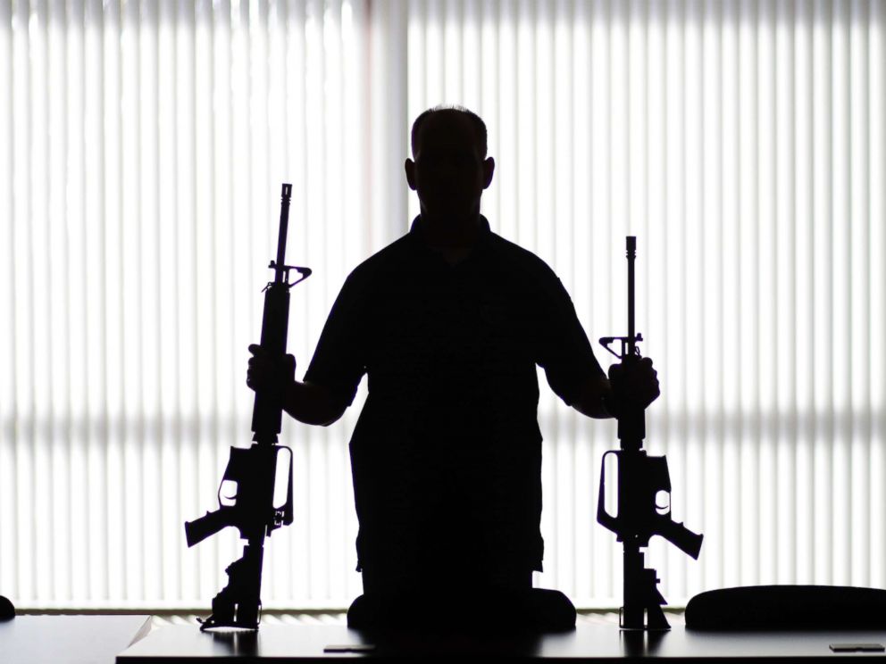 PHOTO: In this Aug. 29, 2017, photo, an ATF agent poses with homemade rifles, or ghost guns, at an ATF field office in Glendale, Calif.