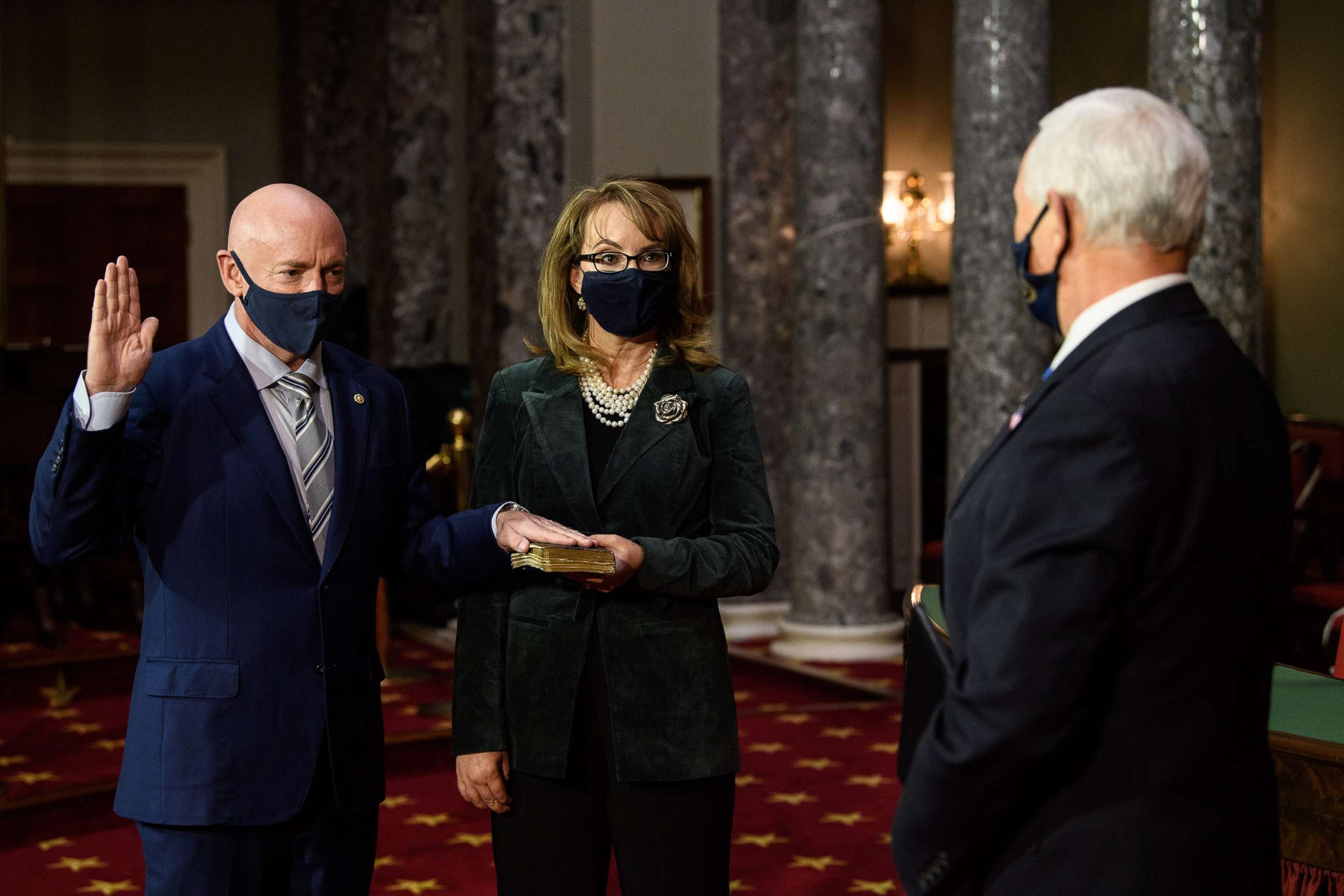 PHOTO: Vice President Mike Pence, Senator Mark Kelly (D-AZ) and Kelly's wife former Rep. Gabby Giffords participate in a swearing in reenactment at the Capitol, Dec. 2, 2020.