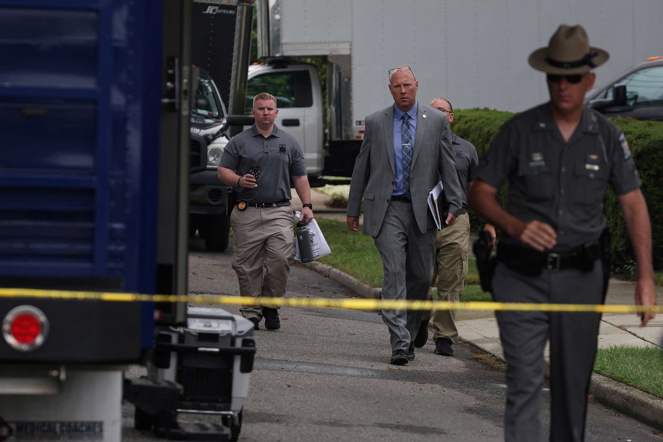 PHOTO: Crime scene investigators are pictured at the residence of architect Rex A. Heuermann, who was arrested as a suspect in connection with serial killings more than a decade ago along Gilgo Beach, July 19, 2023, in Massapequa Park, N.Y.