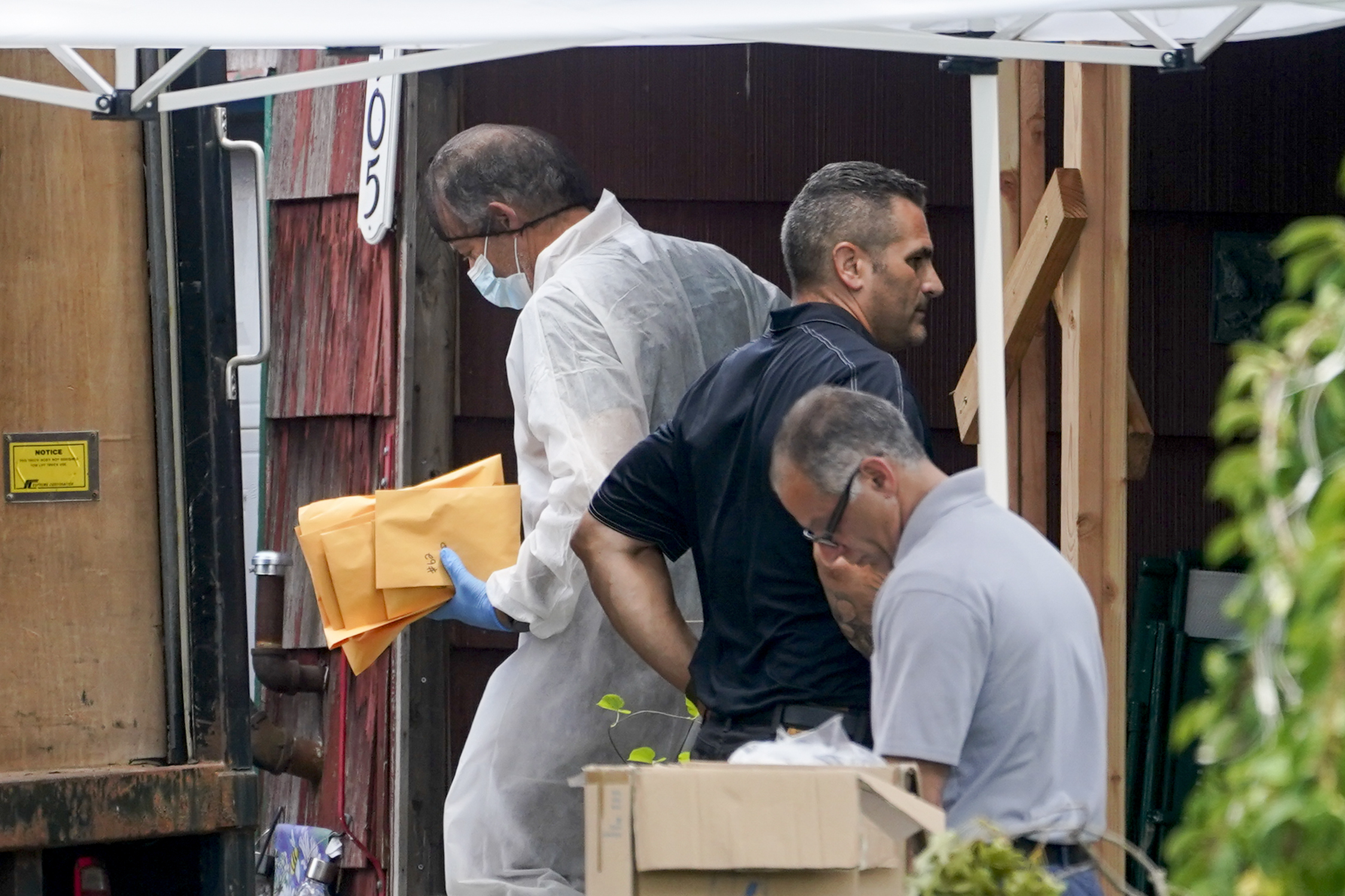 PHOTO: Authorities remove evidence as they search the home of suspect Rex Heuermann, Tuesday, July 18, 2023, in Massapequa Park, N.Y.