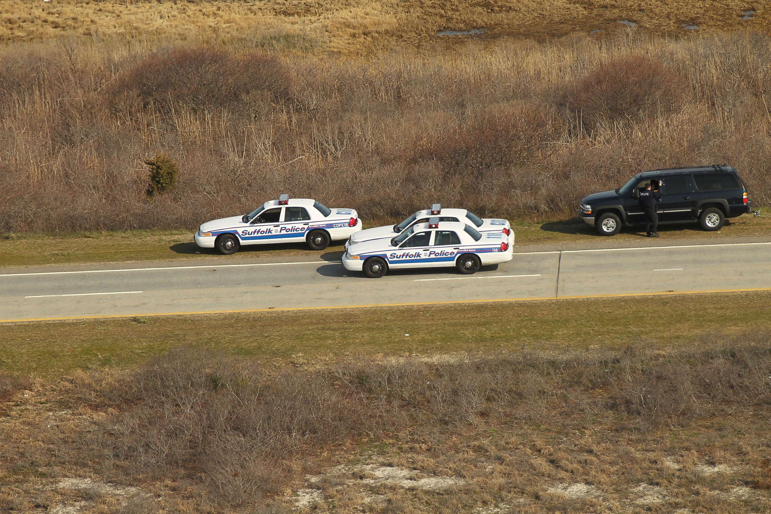 PHOTO: An aerial view of police cars near where a body was discovered in the area near Gilgo Beach and Ocean Parkway on Long Island, April 15, 2011, in Wantagh, New York. 