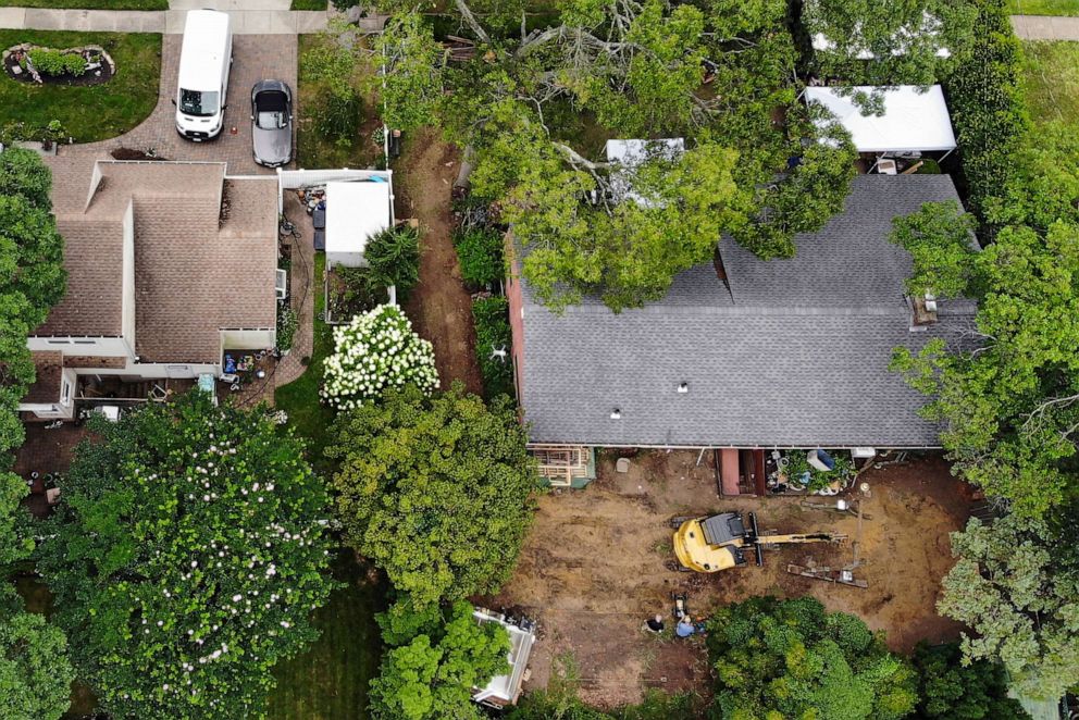 PHOTO: Authorities continue to work at the home of suspect Rex Heuermann, bottom right, in Massapequa Park, N.Y., July 24, 2023, charged with killing at least three women in the long-unsolved slayings known as the Gilgo Beach killings.