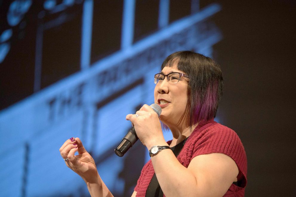 PHOTO: Ginger Chien speaks on stage at an Ignite Seattle event, a non-profit group centered on building community through sharing diverse stories and challenging ideas.
