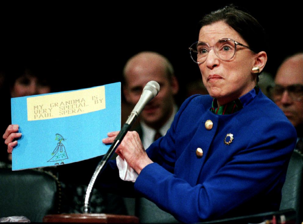 PHOTO: US Supreme Court nominee Ruth Bader Ginsburg holds up a drawing of herself with the words "My Grandmother Is Very Special by Paul Spera" before the Senate Judiciary Committee, July 20, 1993, on Capitol Hill in Washington.