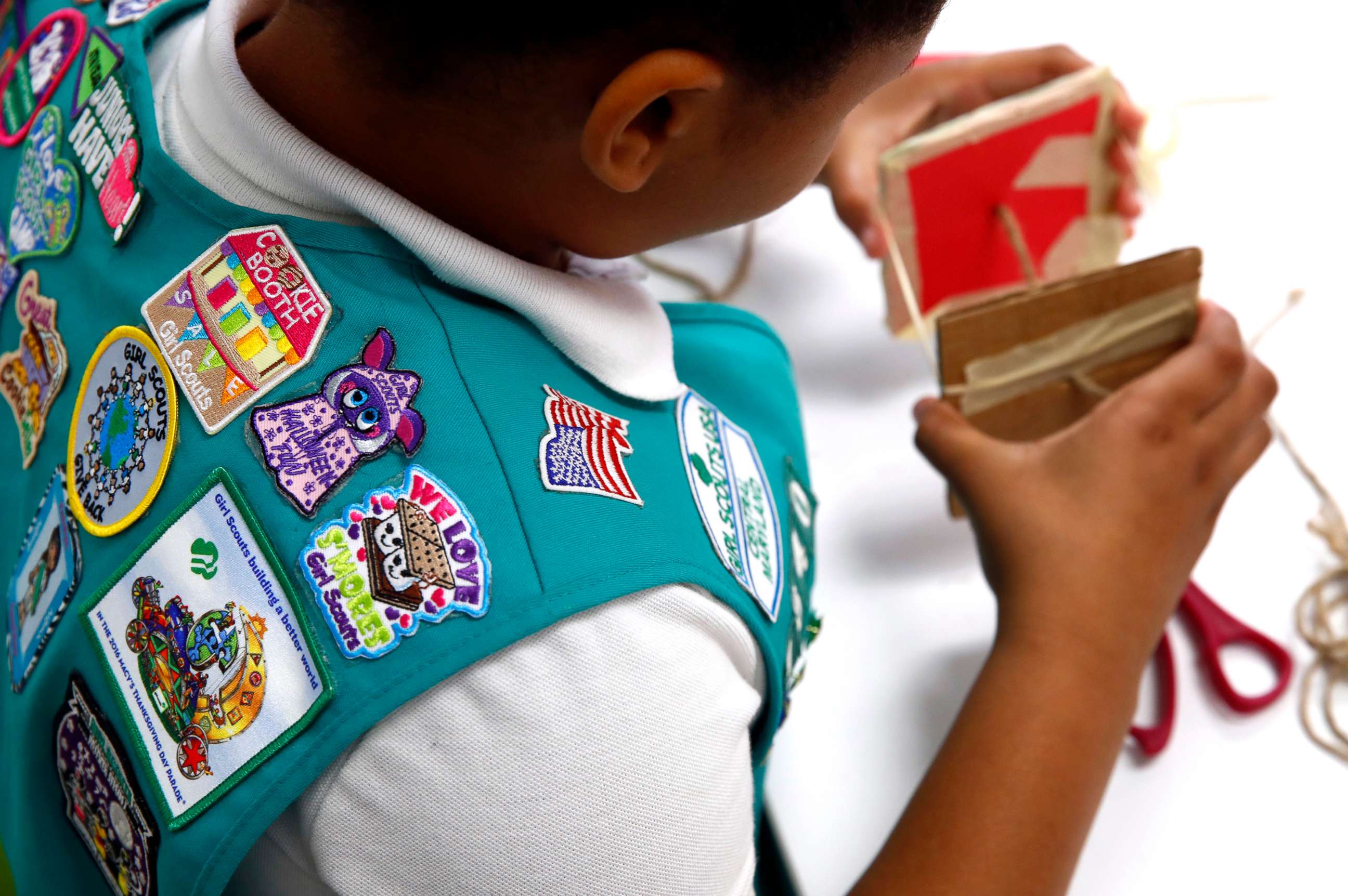 PHOTO: In this July 21, 2017, photo, badges are seen on the vest of a member of the Girl Scouts as she participates in an activity introducing the world of robotics in Owings Mills, Md. 