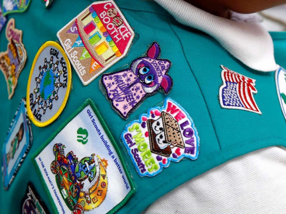 PHOTO: In this July 21, 2017, photo, badges are seen on the vest of a member of the Girl Scouts as she participates in an activity introducing the world of robotics in Owings Mills, Md.