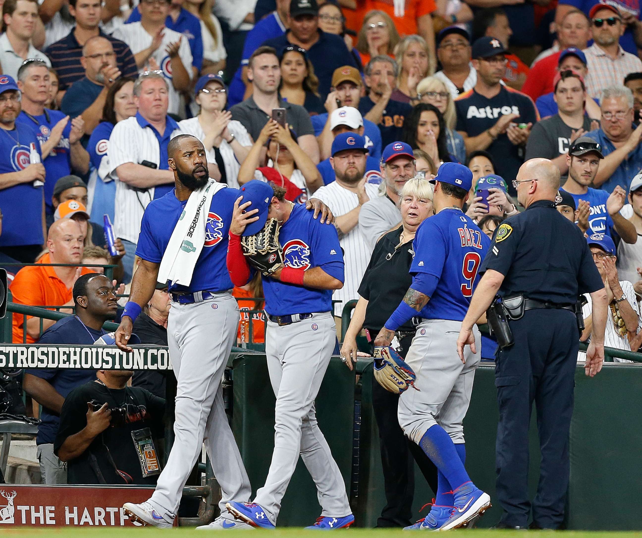 PHOTO: Albert Almora Jr. of the Chicago Cubs is comforted by Jason Heyward after checking on the young child that was injured by a hard foul ball off his bat at Minute Maid Park on May 29, 2019, in Houston.