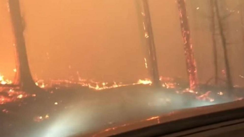A son and his 70-year-old father barely escaped as they drove right through a raging forest fire in West Glacier, Montana.
