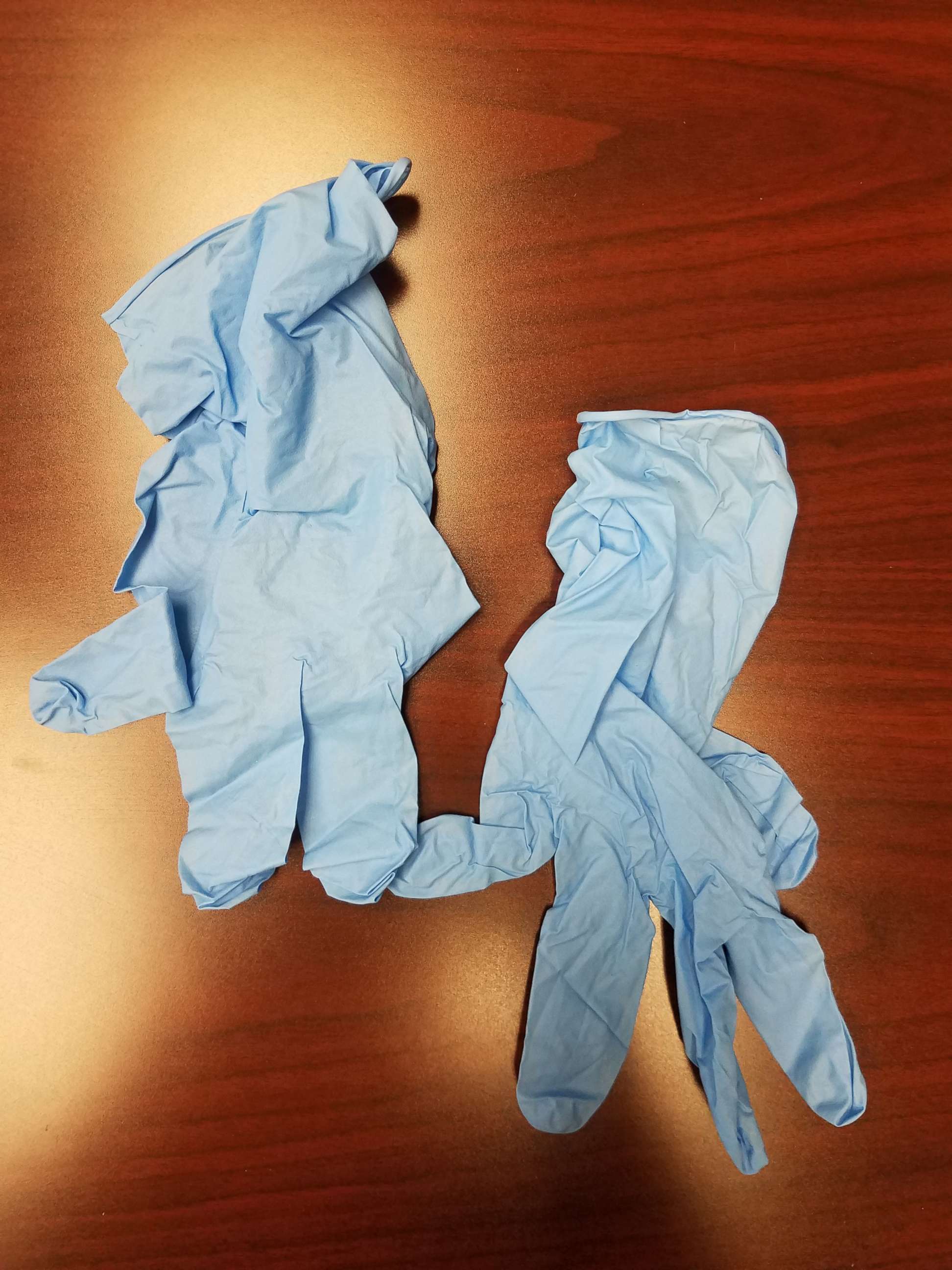 PHOTO: A pair of blue-colored gloves were sent to a Detroit woman after she complained to Samsung that her mobile devices caught fire, May 21, 2018.