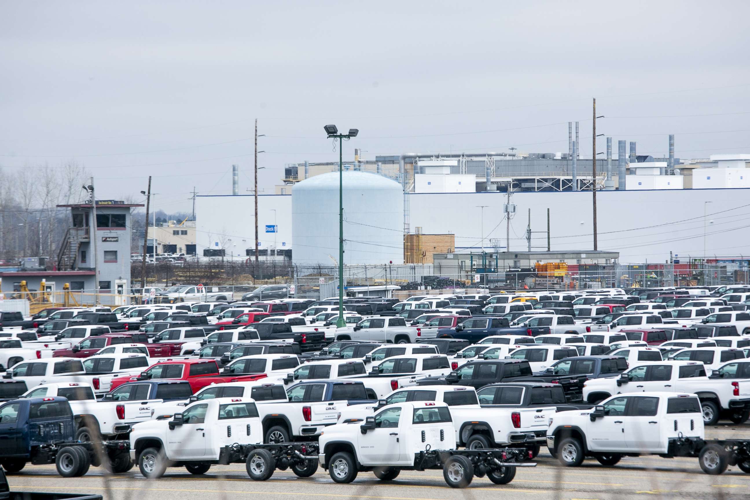 PHOTO: New vehicles sit in a lot in front of the idled General Motors Co. Flint Assembly plant in Flint, Michigan, March 23, 2020.