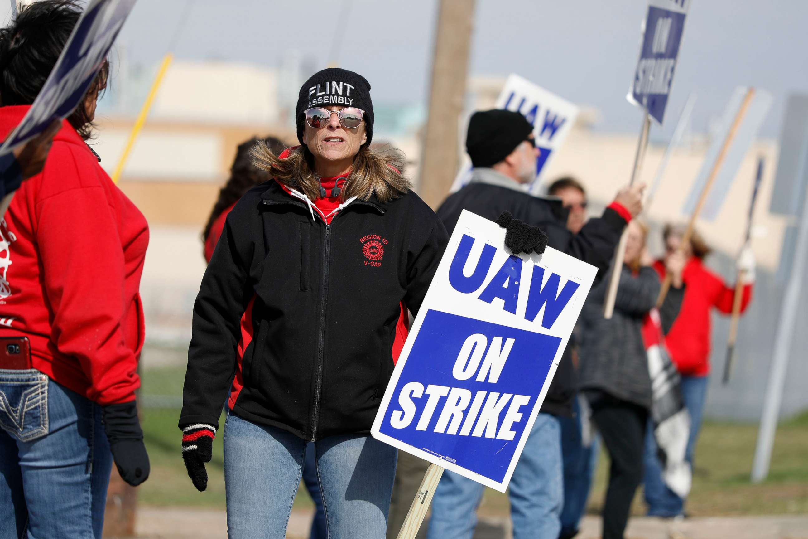 PHOTO: United Auto Workers union members and their families picket at the General Motors Flint Assembly plant on Solidarity Sunday on Oct. 13, 2019. in Flint, Michigan.