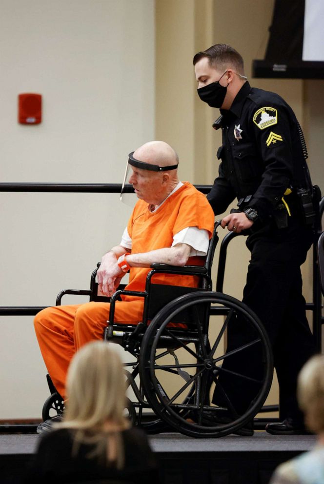 PHOTO: A police officer pushes the wheelchair of Joseph James DeAngelo Jr. as he arrives at the Sacramento County courtroom for a hearing on crimes attributed to the Golden State Killer, in Sacramento, Calif., June 29, 2020.