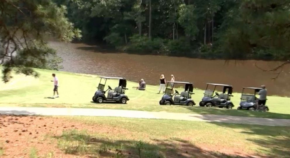 PHOTO: People pay their respects at the scene of the shooting death of pro golfer Gene Siller who was shot and killed on July, 3, 2021 at Pinetree Country Club in Kennesaw, Ga.