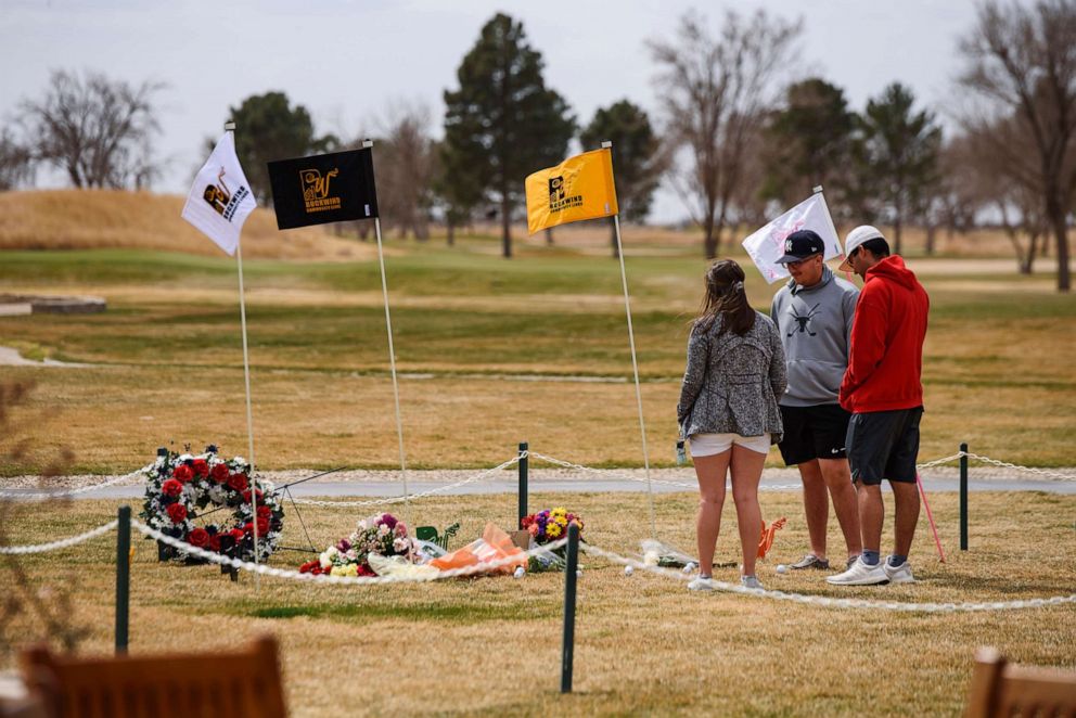 PHOTO: University of the Southwest golfers from left, Halie Cruz, Phillip Lopez, and Jonny Flores, visit the site of a memorial erected for the victims of the USW golf teams vehicle collision, March 17, 2022, at the Rockwind Community Links in Hobbs, N.M.