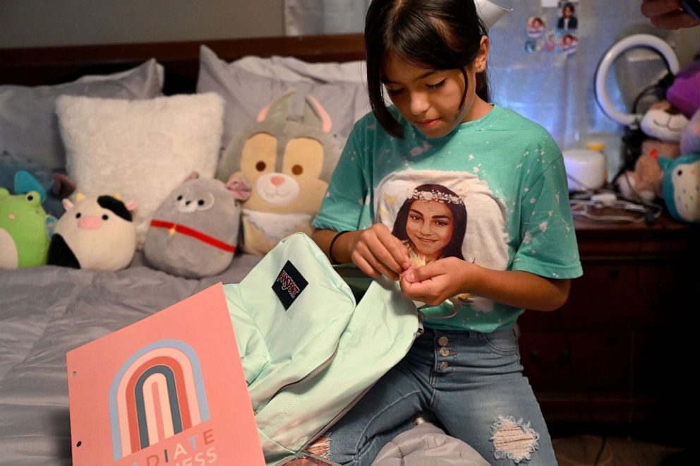 PHOTO: Wearing a shirt with her best friend Jackie Cazares, Caitlyne Gonzales prepares her backpack for the start of the new school year, Sept. 5, 2022, in Uvalde, Texas.