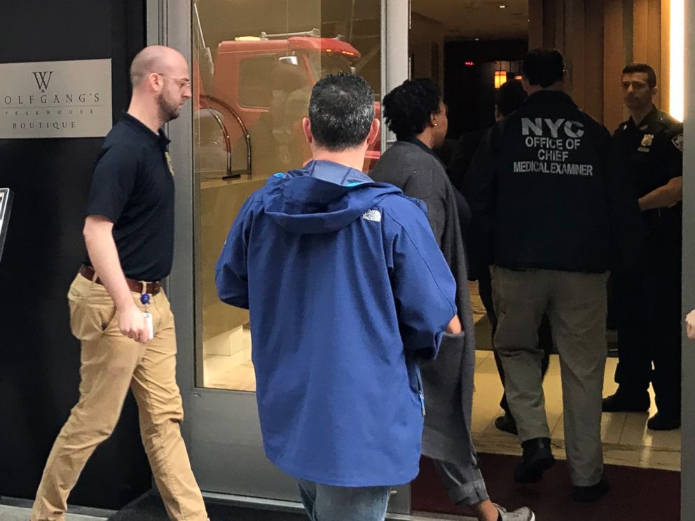 PHOTO: Authorities from the New York City Office of the Chief Medical Examiner enter the Gotham Hotel in New York after reports that a woman jumped from the building with a child on May 18, 2018.