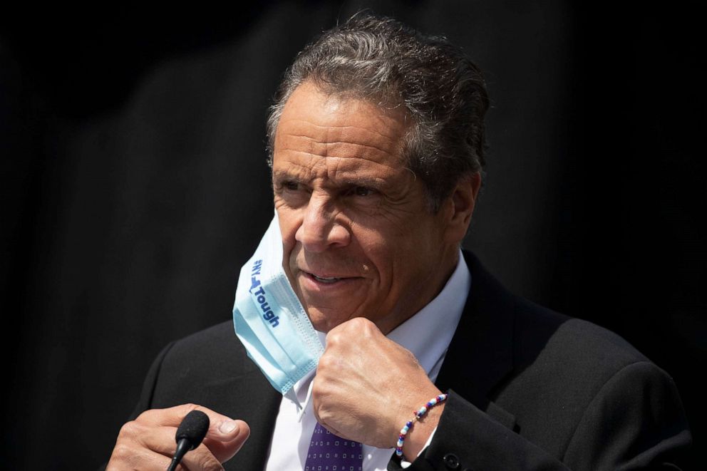 PHOTO: New York Gov. Andrew Cuomo removes a mask as he holds a news conference in Tarrytown, N.Y., June 15, 2020.
