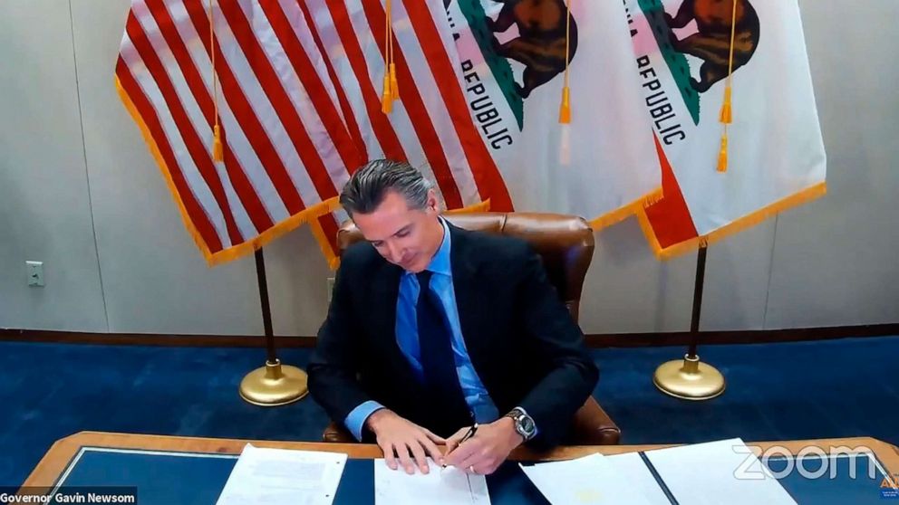 PHOTO: In this screen grab from a video, California Gov. Gavin Newsom signs into law a bill that establishes a task force to come up with recommendations on how to give reparations to Black Americans, Sept. 30, 2020, in Sacramento, Calif.