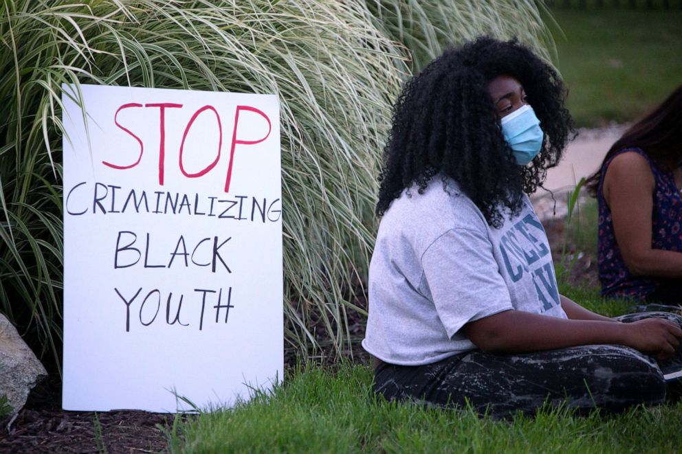 PHOTO: Ashleigh Givens joins an overnight occupation to free "Grace" a 15-year-old Black teen who was detained to the juvenile detention facility for breaking her probation by not doing her online school work, Pontiac, Mich.,  July 29, 2020.