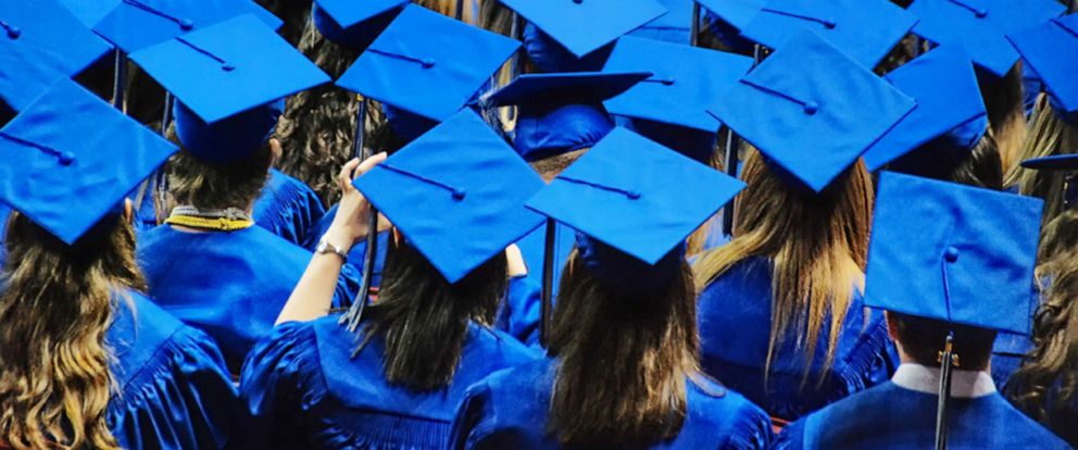 High school senior decorates graduation  cap with QR code  