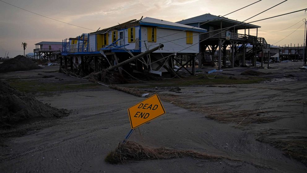 PHOTO: Sand and debris covers a road in a damaged neighborhood in the aftermath of Hurricane Ida, Sept. 6, 2021, in Grand Isle, La.