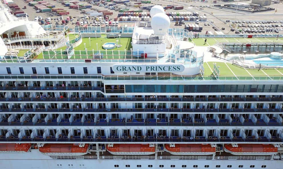 PHOTO: Passengers look out as the Grand Princess cruise ship docks at the Port of Oakland in Oakland, California, on March 9, 2020.