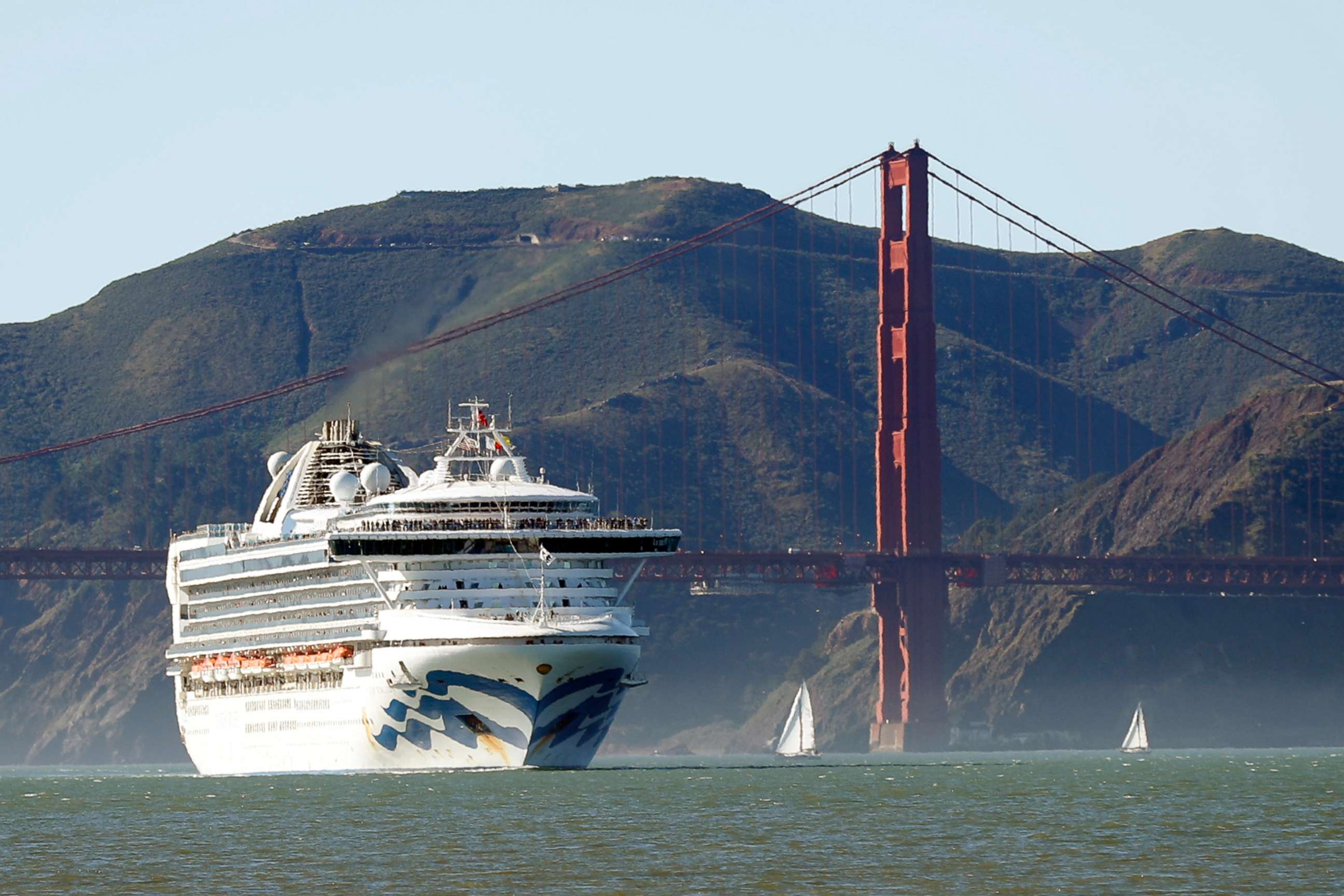 PHOTO: In this photo taken on Feb. 11, 2020, the Grand Princess cruise ship passes the Golden Gate Bridge as it arrives from Hawaii in San Francisco.