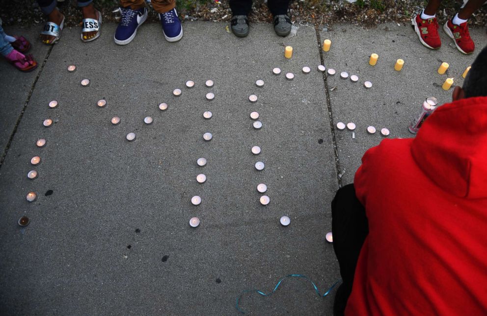 PHOTO: Candles spell "MG" at a vigil for Maurice Granton, Jr., in Chicago on June 7, 2018. An autopsy revealed he was shot in the back. 