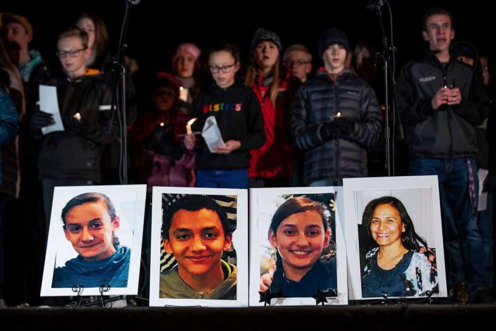 PHOTO: Photographs of Consuelo Alejandra Haynie, 52, right, and three of her children are displayed at a candlelight vigil for the Haynie family at City Park in Grantsville, Utah, Jan. 20, 2020.