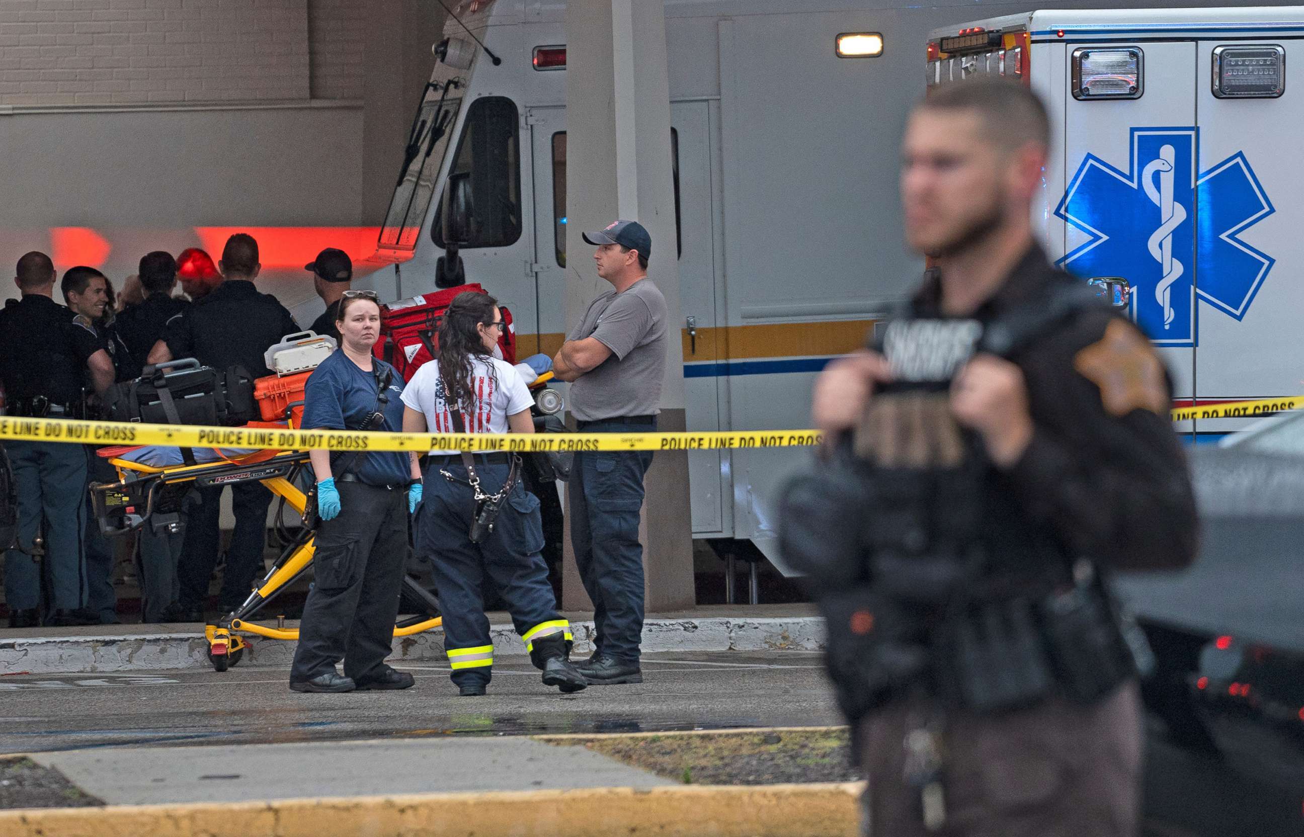 PHOTO: Emergency personnel gather after a shooting, July 17, 2022, at Greenwood Park Mall, in Greenwood, Ind.