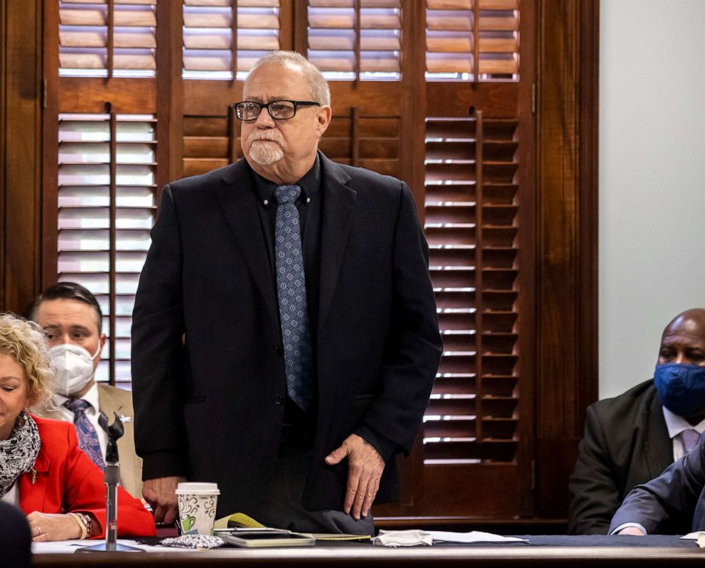 PHOTO: In this Oct. 25, 2021, file photo, Greg McMichael stands to be recognized during jury selection for the trial of he and his son Travis McMichael and William "Roddie" Bryan, at the Glynn County Courthouse, in Brunswick, Ga.