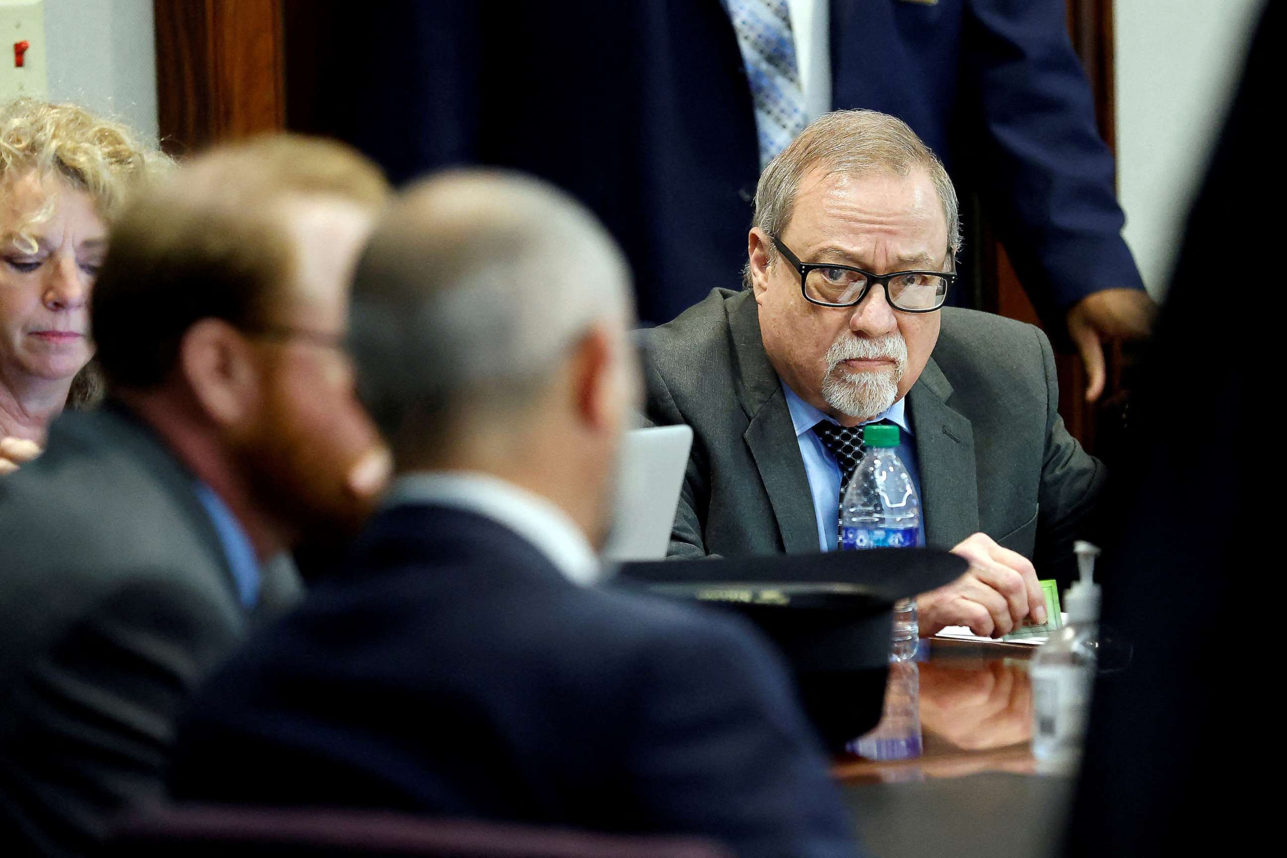 PHOTO: Greg McMichael, right, waits for sentencing along with his son, Travis McMichael, and William "Roddie" Bryan in the Glynn County Courthouse in Brunswick, Ga., Jan. 7, 2022.