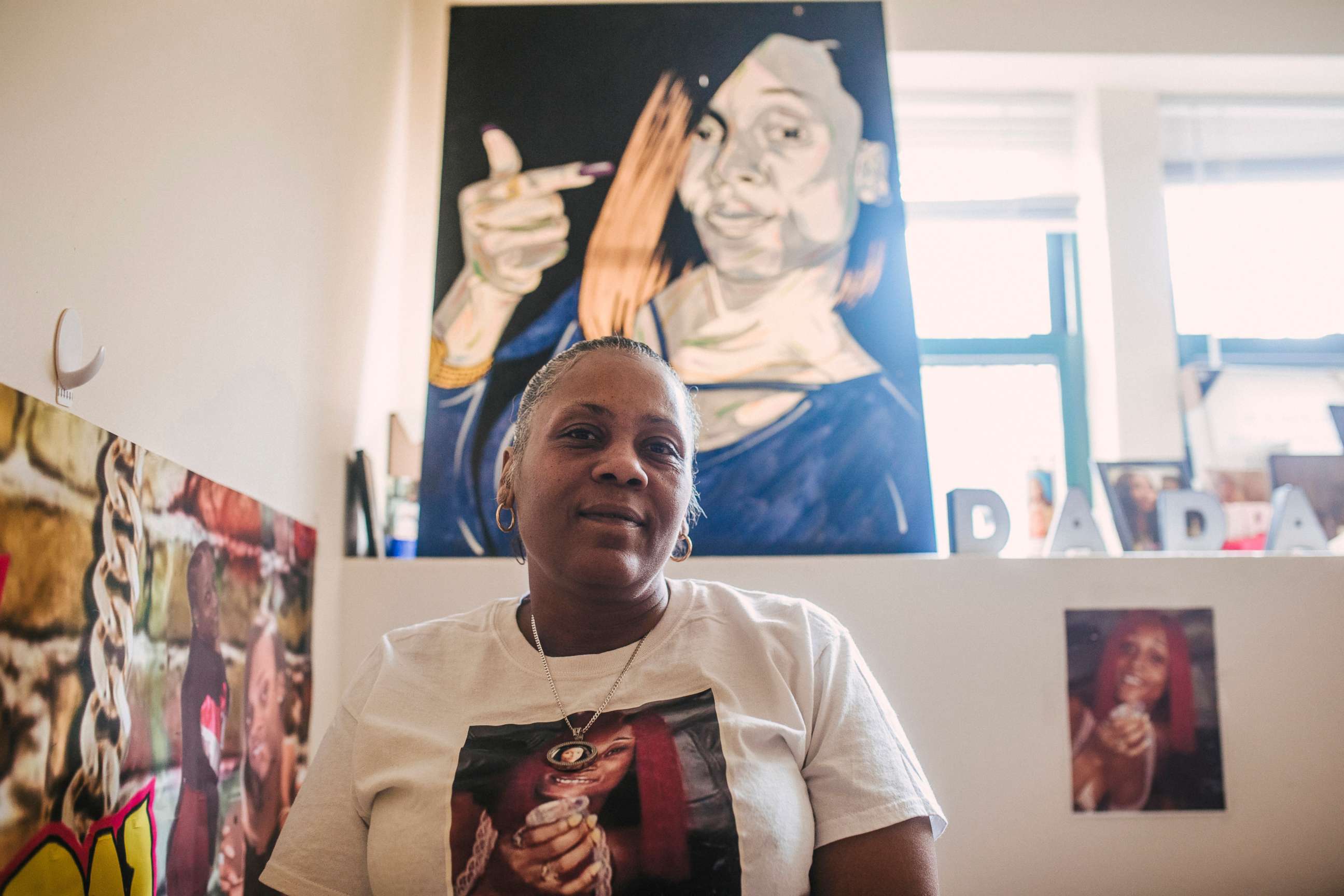 PHOTO: Valerie Griffin sits in front of a portrait of her daughter, De'Janay Stanton, at her home in Chicago, Nov. 19, 2021.