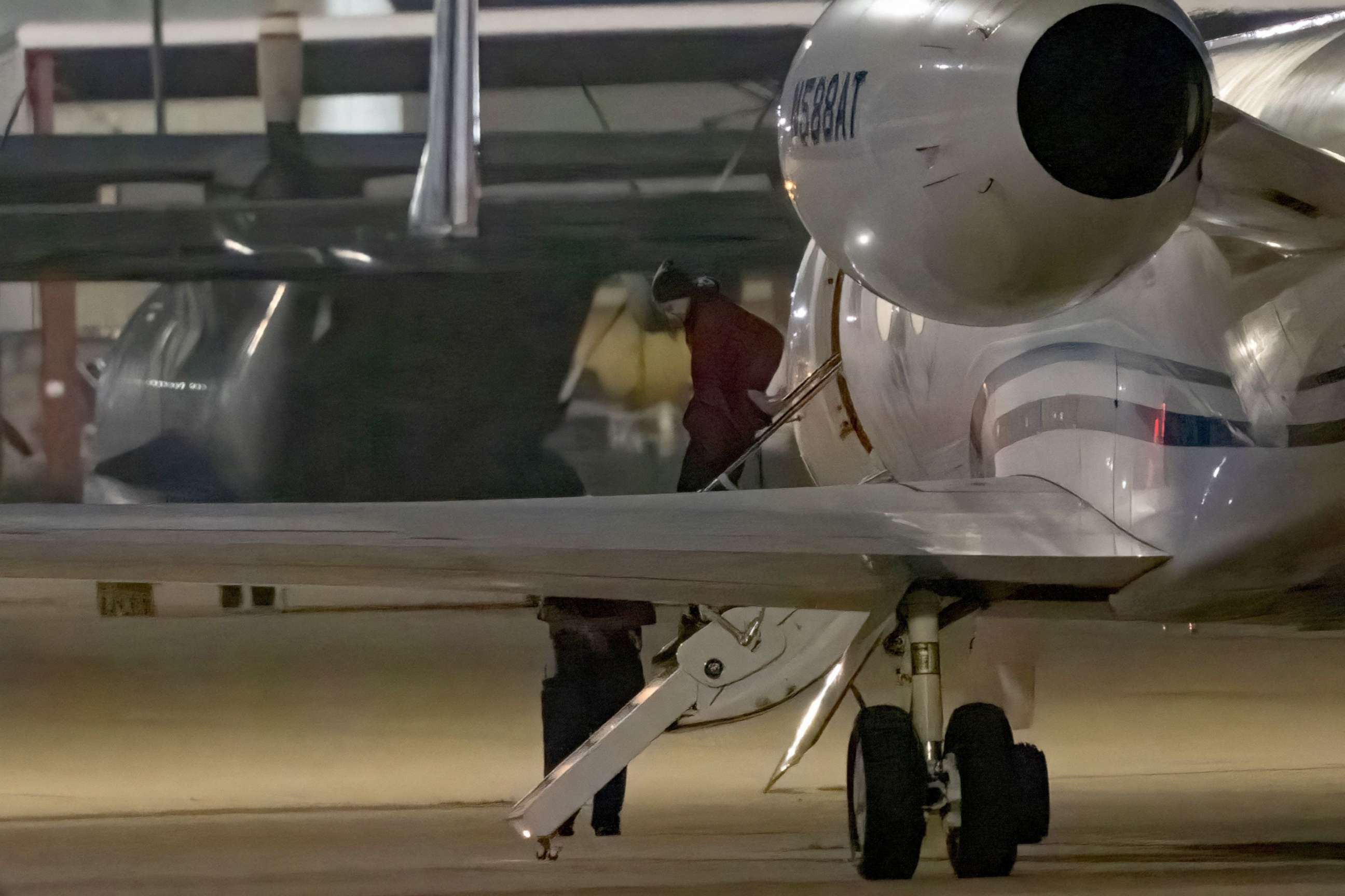 PHOTO: TOPSHOT - American basketball star Brittney Griner gets out of a plane after landing at the JBSA-Kelly Field Annex runway on December 9, 2022 in San Antonio, after she was released from a Russian prison in exchange for a notorious arms dealer.