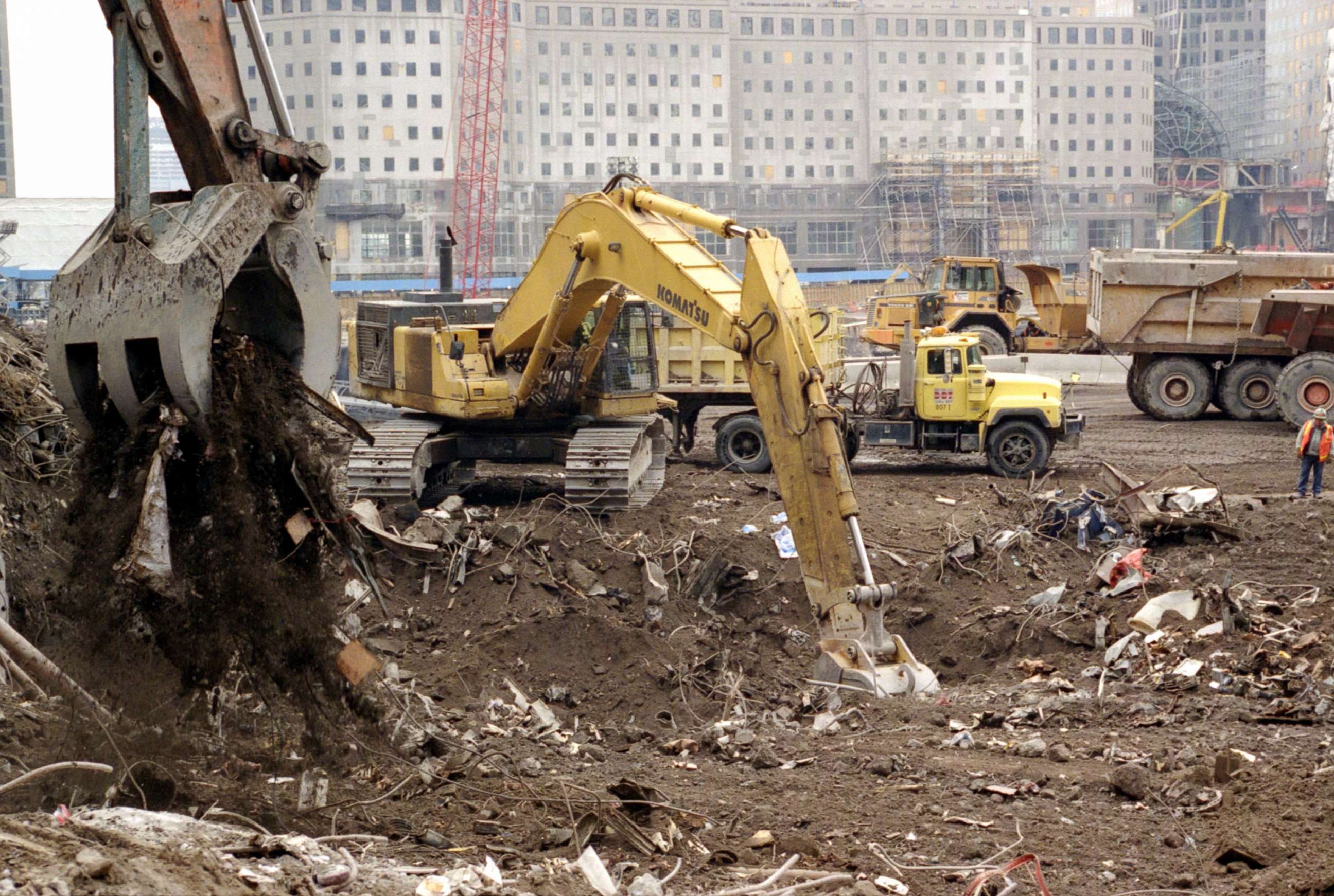 PHOTO: Earth movers collect debris to be sifted through by fire fighters and Port Authority Police officers in order to recover remains and evidence at Ground Zero, the former site of the World Trade Center, Feb. 22, 2002, in New York City.