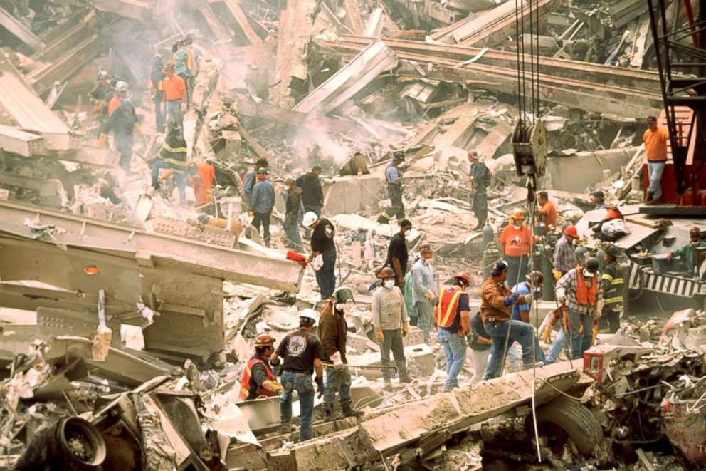 PHOTO: Firefighters search for survivors at the wreckage of the World Trade Center Towers on Sept. 12, 2001, after a terrorist attack in New York.