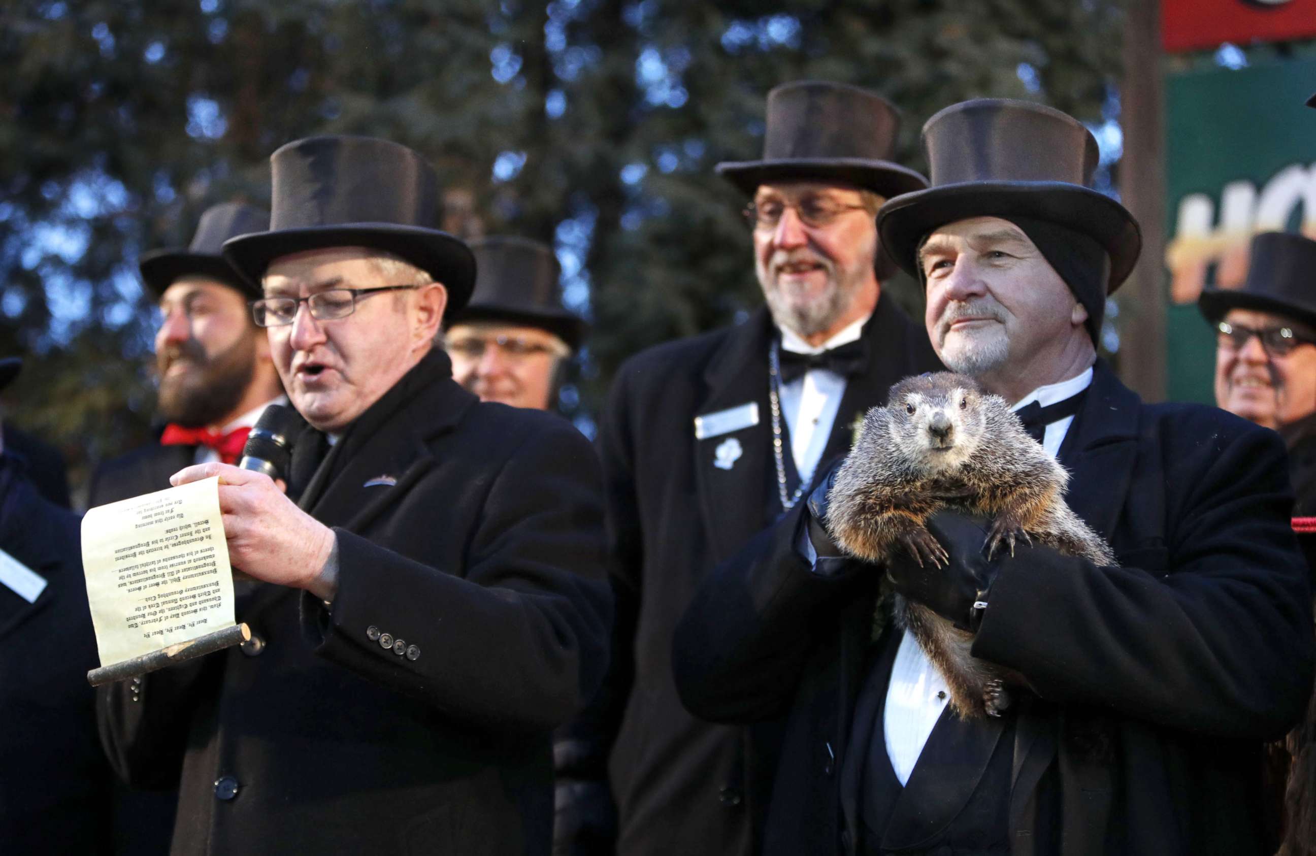 PHOTO: Groundhog Club co-handler John Grifiths (R) holds Punsxutawney Phil the weather prognosticating groundhog as groundhog club vice president Jeff Lundy (L) reads his prediction during the Groundhog Day in Punxsutawney, Penn., Feb 2, 2018. 