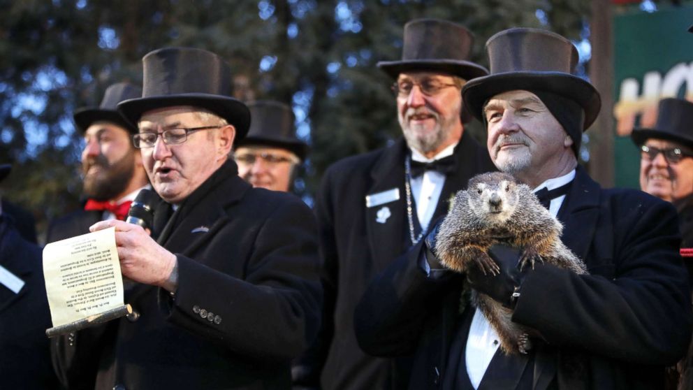 PHOTO: Groundhog Club co-handler John Grifiths (R) holds Punsxutawney Phil the weather prognosticating groundhog as groundhog club vice president Jeff Lundy (L) reads his prediction during the Groundhog Day in Punxsutawney, Penn., Feb 2, 2018. 