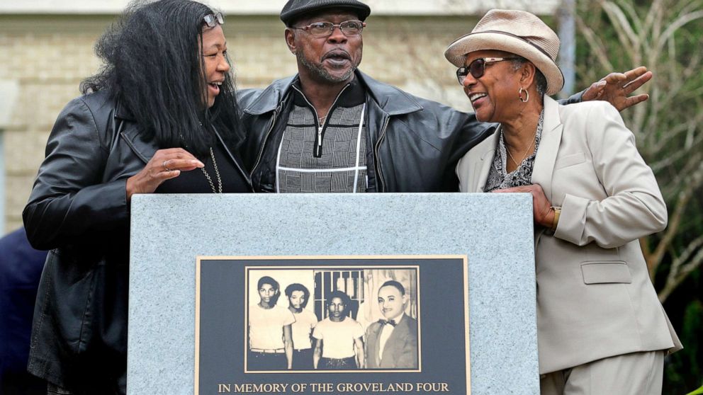 PHOTO: From left, Vivian Shepherd, niece of Sam Shepherd; Gerald Threat, nephew of Walter Irvin; Carol Greenlee, daughter of Charles Greenlee, gather at the just-unveiled monument in front of the County courthouse in Tavares, Fla., Feb. 21, 2020.
