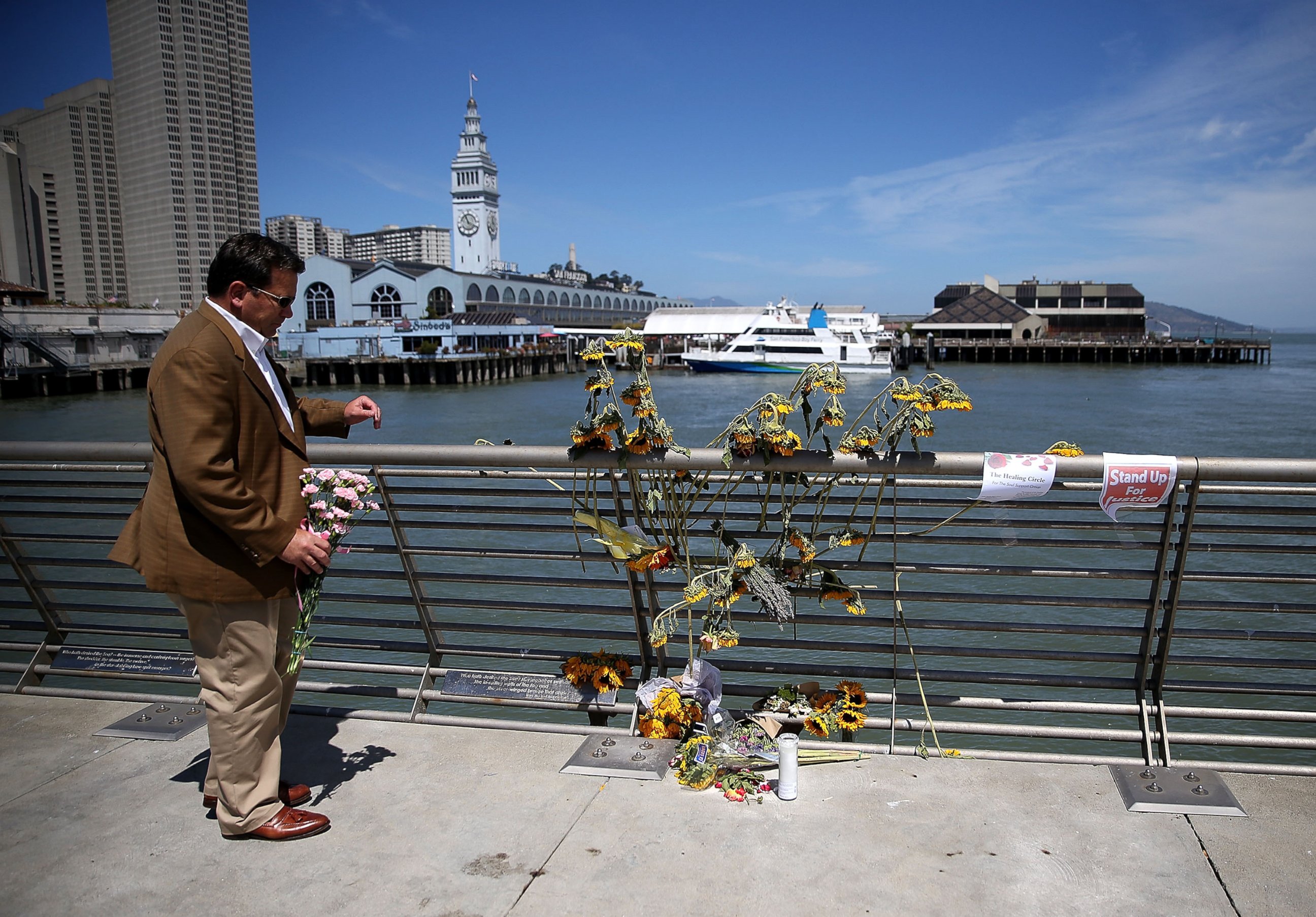 PHOTO: A well-wisher drops off flowers at the site where 32-year-old Kate Steinle was killed on July 6, 2015 in San Francisco.