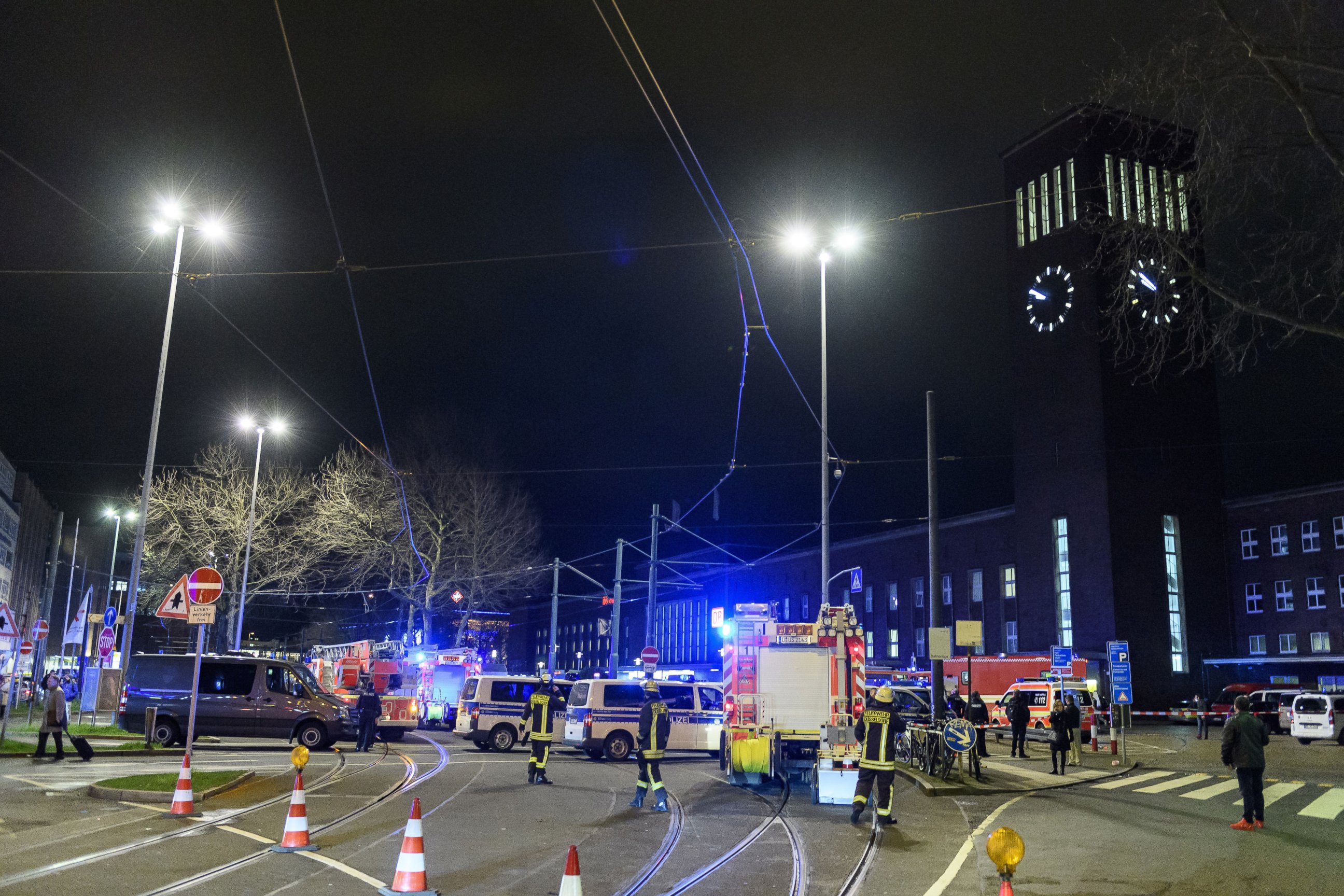 PHOTO: Police and emergency workers stand outside the main railway station following what police described as an ax attack, March 9, 2017 in Dusseldorf, Germany.