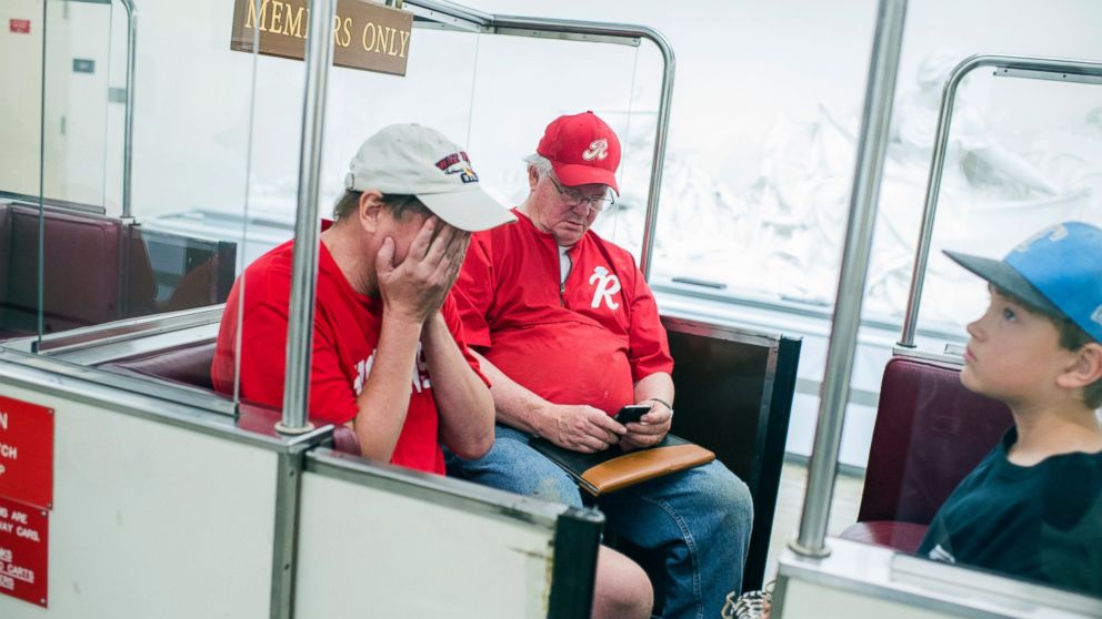 Rep. Joe Barton, center, and his sons, board the Rayburn subway in the basement of the Capitol after a shooting at the Republican's baseball practice in Alexandria, June 14, 2017. 