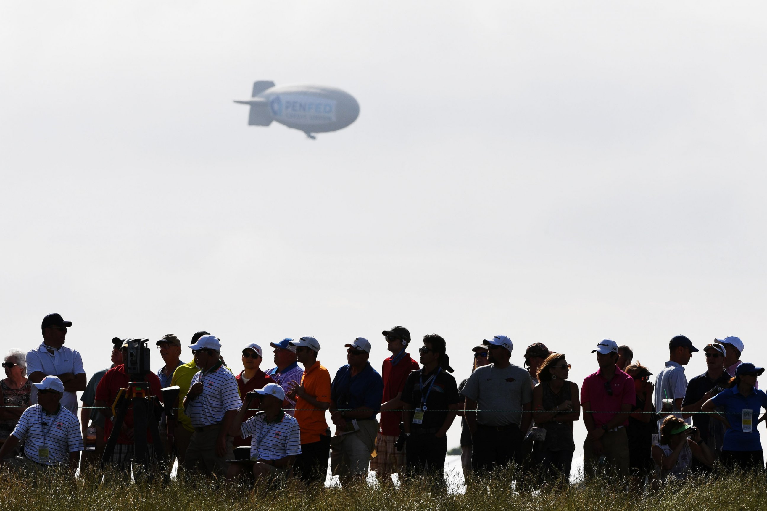PHOTO: A blimp floats over the crowd during the first round of the 2017 U.S. Open at Erin Hills on June 15, 2017 in Hartford, Wis.