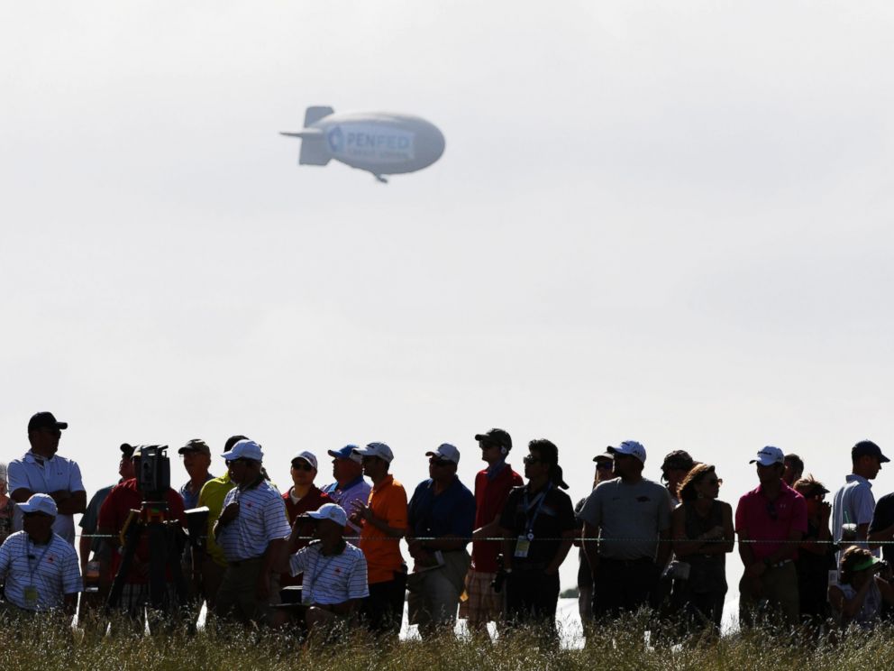 PHOTO: A blimp floats over the crowd during the first round of the 2017 U.S. Open at Erin Hills on June 15, 2017 in Hartford, Wis.