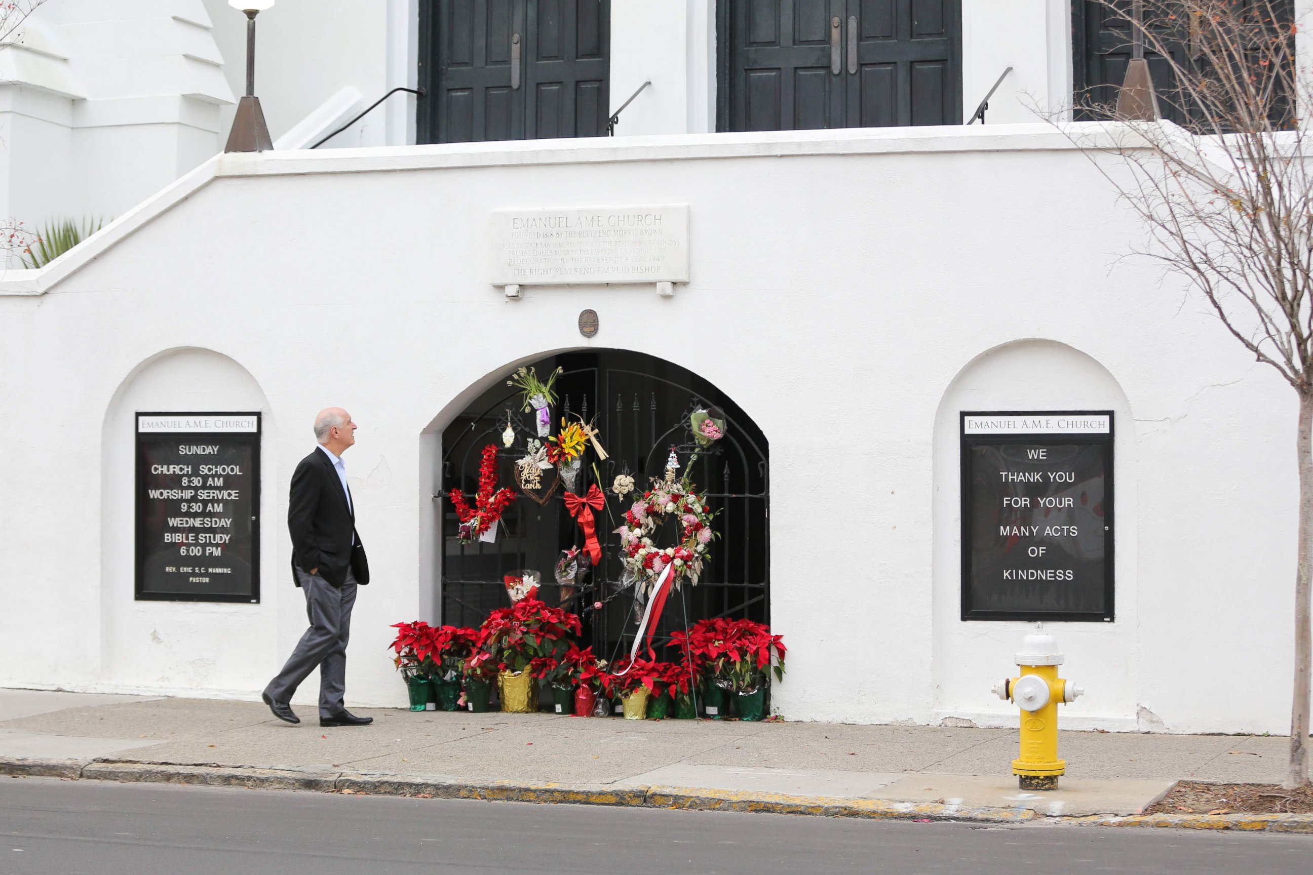 PHOTO: A man stops to observe the makeshift memorial in front of Mother Emanuel AME Church in downtown Charleston, South Carolina on Jan. 4, 2017.