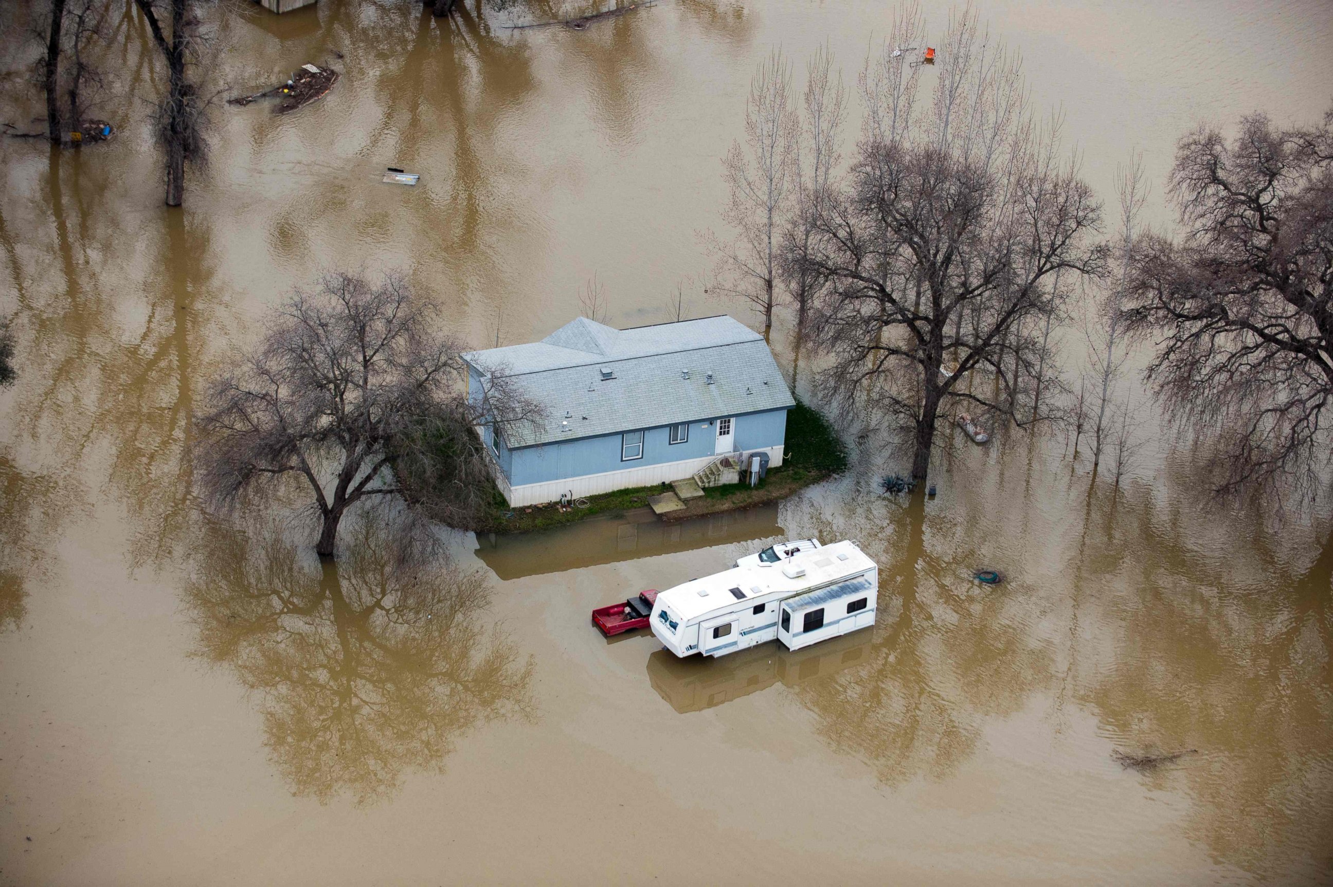 PHOTO: A home is seen marooned as the surrounding property is submerged in flood water in Oroville, California, Feb. 13, 2017.
