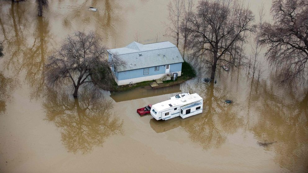 PHOTO: A home is seen marooned as the surrounding property is submerged in flood water in Oroville, California, Feb. 13, 2017.
