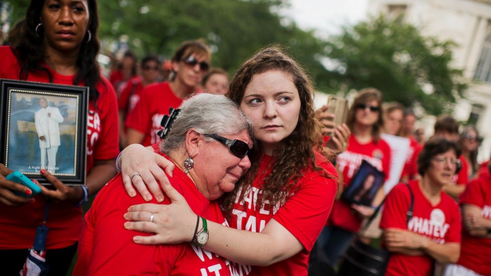 PHOTO: Ashley Cech, right, whose mother survived the Sandy Hook shootings, comforts Diane Sellgren, whose daughter committed suicide with a gun during a gun legislation rally outside the Capitol organized by Everytown for Gun Safety, Sept. 10, 2015.