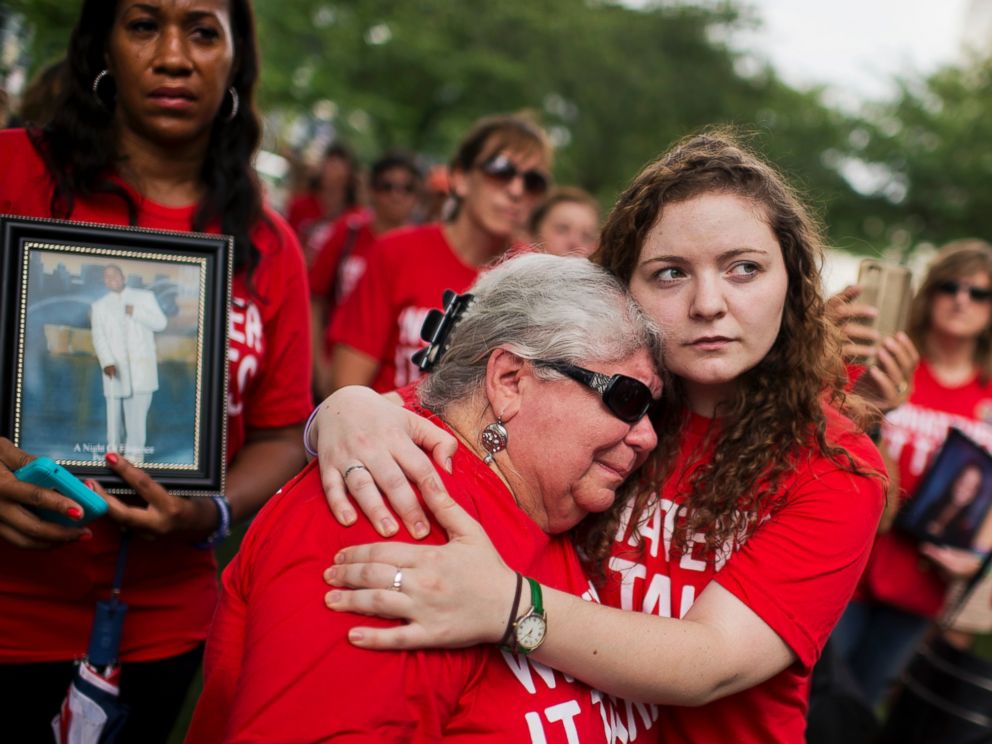 PHOTO: Ashley Cech, right, whose mother survived the Sandy Hook shootings, comforts Diane Sellgren, whose daughter committed suicide with a gun during a gun legislation rally outside the Capitol organized by Everytown for Gun Safety, Sept. 10, 2015.